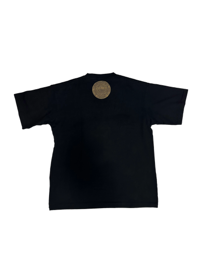 Back view of a black short sleeve t-shirt featuring a round logo on the upper back.